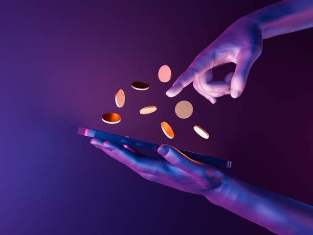 Photo of hands with coins